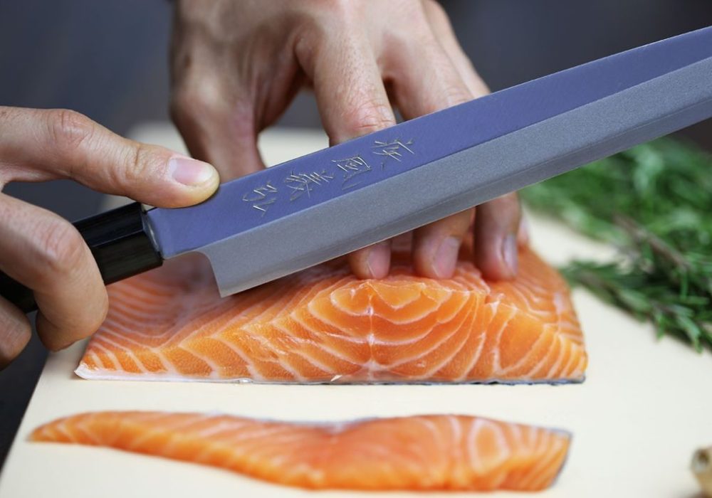 Image of chef cutting fish